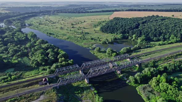 Railway Bridge Crossing a Beautiful Valley During the Summer Season alt