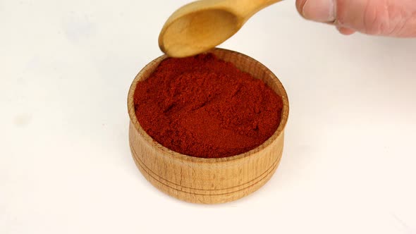 Chef Taking Spices Dry Red Pepper From Wooden Spice Jar alt