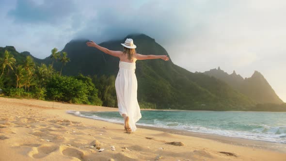 Smiling Woman Dancing on Beach Outdoors Happy Girl White Dress Turning Around alt