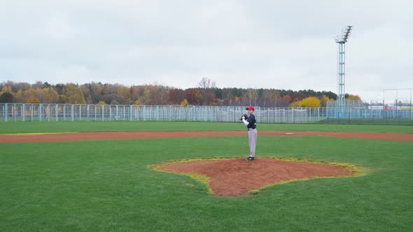 Baseball at School the Pitcher Pitches Fastball Toward Batter Boy Throwing the Ball alt