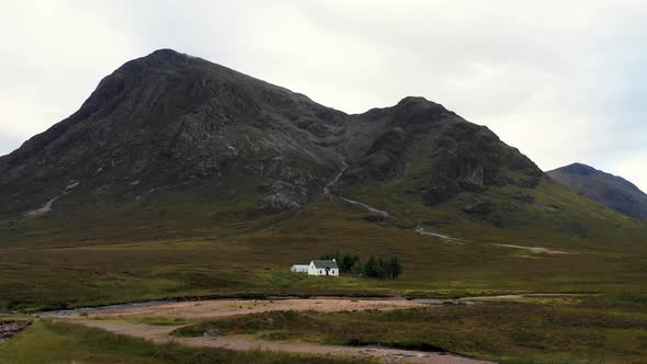 Aerial view of a cottage in a remote location of the highlands in Scotland