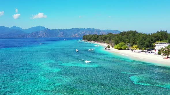 Aerial flying over nature of marine shore beach adventure by blue sea with white sandy background of alt