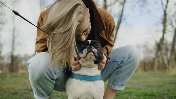 Young LGBT Lesbian Woman Playing with Her Dog alt