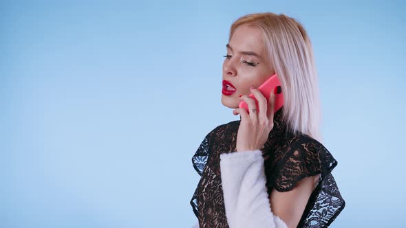 A Emotional Young Woman Talking on the Phone