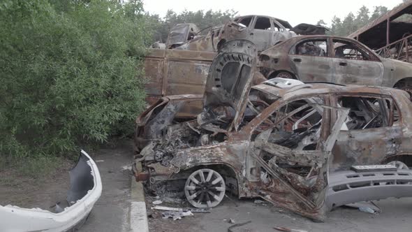 War in Ukraine a Dump of Burned Cars in Irpin Bucha District alt