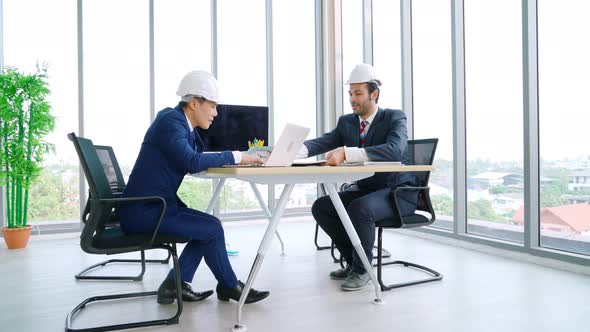 Engineer and Architect Meeting at Office Table alt