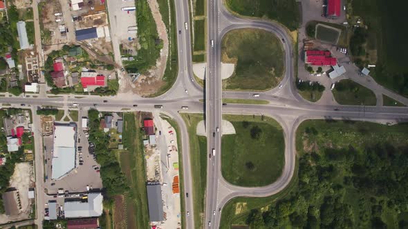 Aerial Drone View of Highway Multilevel Junction Road with Moving Cars Near to City Haos