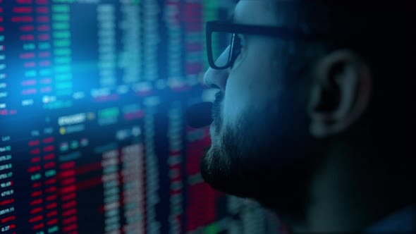 Trader is Working with Multiple Computer Screens with Charts and Data Analysis and Stock Broker alt