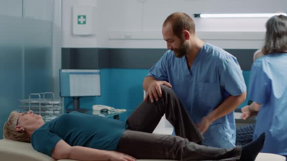 Osteopath Cracking Leg Bones to Heal Old Woman with Mechanical Disorders alt