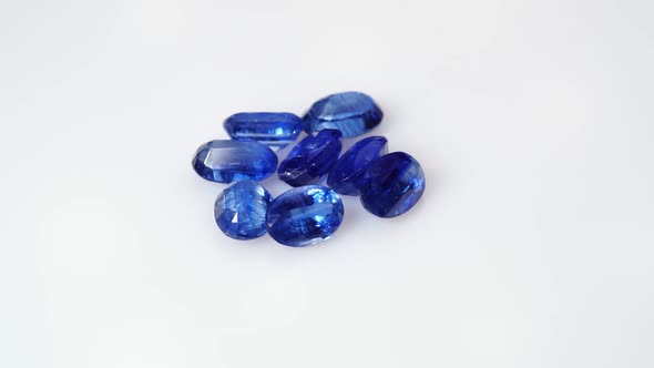 Natural Kyanite Gemstone on the White Background on the Turning Table