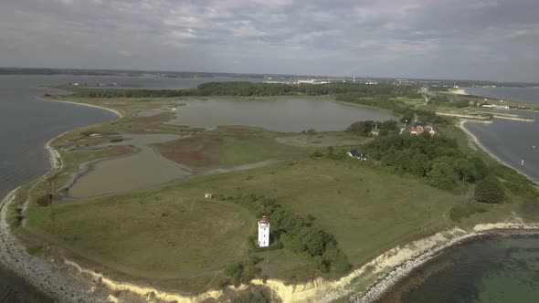 Lighthouse Drone Flies Towards Lighthouse In Wide Shot