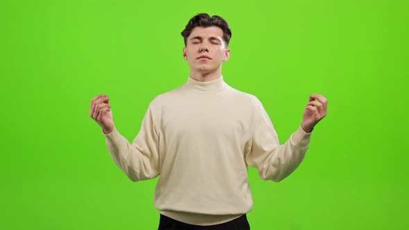 The Man is Standing and Looking at the Camera alt