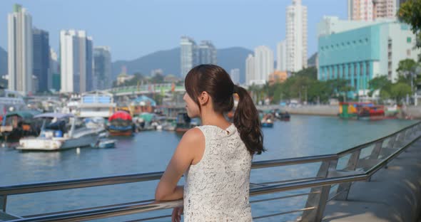 Woman Look Far Away of The Sea View in Hong Kong City alt