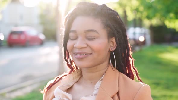 Smiling Attractive Young African American Woman Standing in the Street