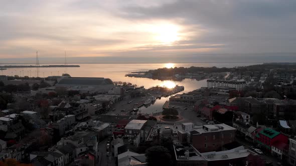 An aerial drone captures sunrise images of Annapolis, Maryland as it flies toward the United States alt
