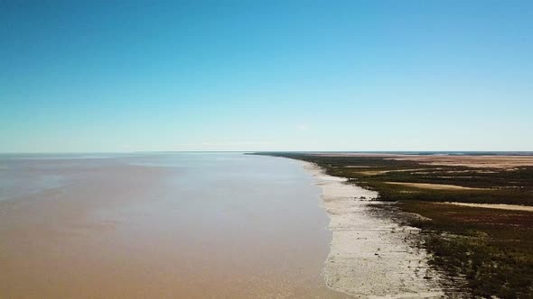 Rising wide angle drone footage showing tidal mudflats in King Sound, Australia, location of second alt