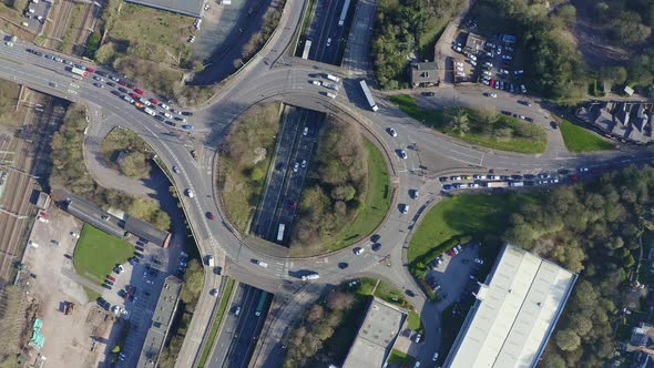 Aerial footage of a large section of commuter motorway, highway, during busy congestion, traffic, ru alt