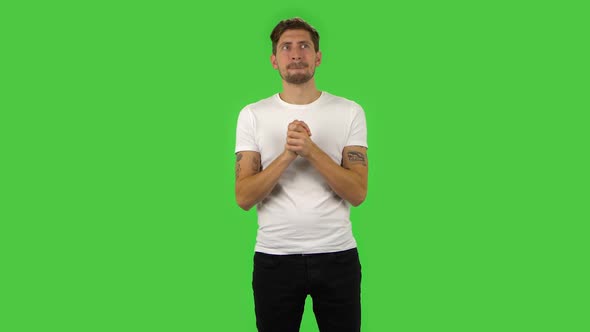 Confident Guy Is Waiting in Anticipation with Pleasure. Green Screen alt
