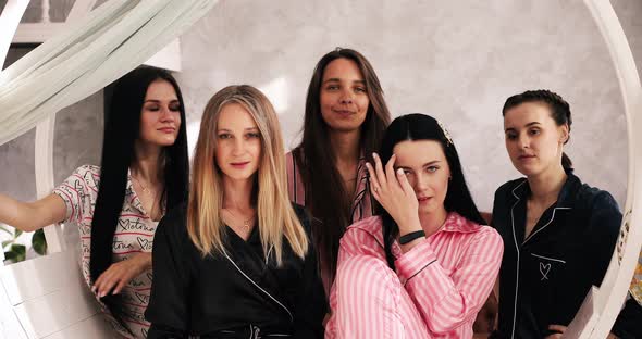 Group of Smiling Pretty Girls Laughing and Smiling in Pajamas