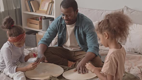 Little Girls Painting Nails of their Dad for Fun alt
