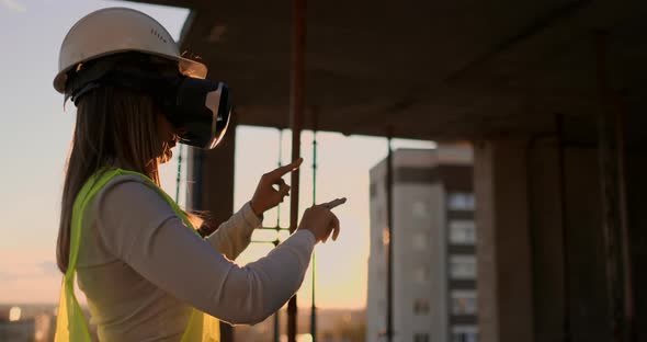 Female Engineer in Hardhat with VR Glasses Designing Construction Project at Manufacturing Plant alt