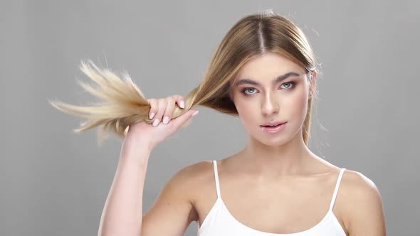 Beautiful Blonde Girl with Strong Hair alt