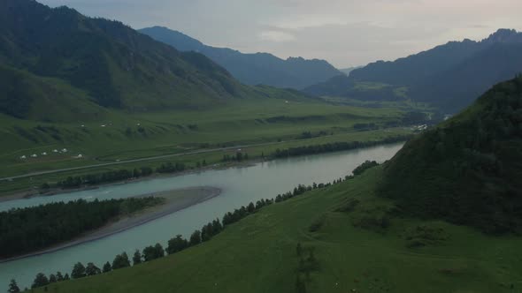 Katun river and mountains of Altai valley at sunset time