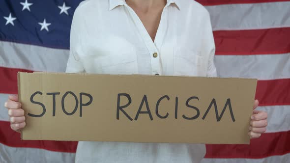 Racism slogan on cardboard.  alt