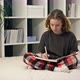Cute Teenage Girl Doing Homework Sitting on the Bed at Home - VideoHive Item for Sale