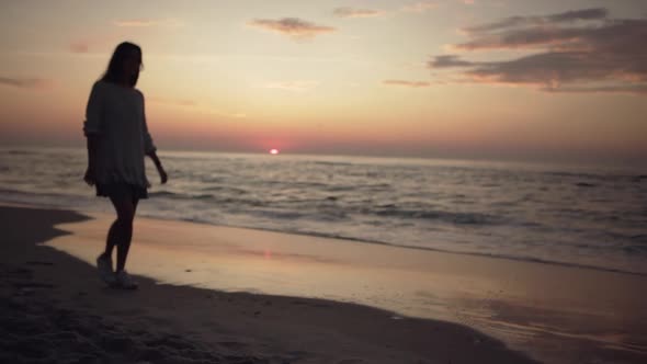 Silhouette of Skinny Longhaired Girl Walking Along Empty Beach Touching Long Hair Enjoying Beautiful alt