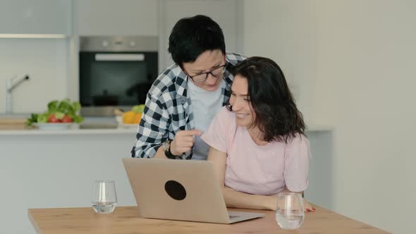 Woman Laughing at Funny Joke Meme Video on Internet While Browsing Internet Rbbro alt