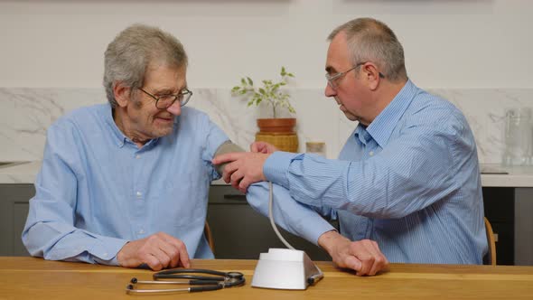 Two Elderly Men Choose Pills for Treatment alt