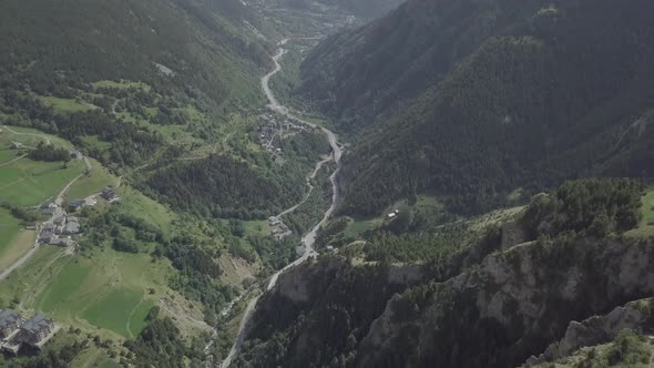 Aerial footage of drone flying above Andorra La Vella, The Pyrenees mountains in summer