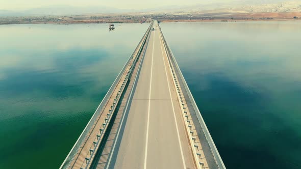 Aerial view of long bridge over river