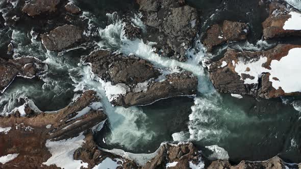 Godafoss Waterfall with Snowy Shore and Ice. Iceland. Winter 2019