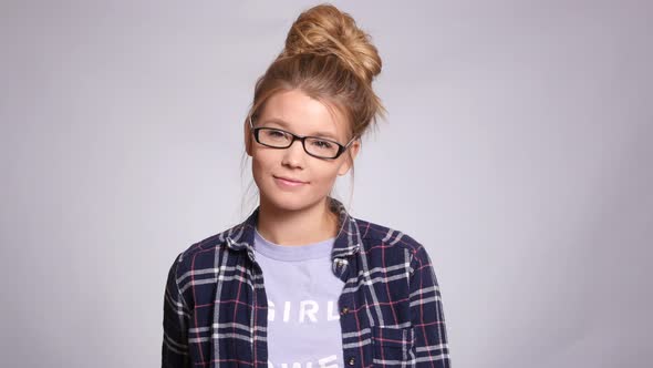 Portrait of young woman on white background