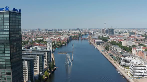 Forwards Descending Fly Above Spree River Towards Molecule Man Tall Sculpture alt