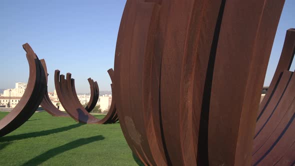 A monument on a green lawn alt