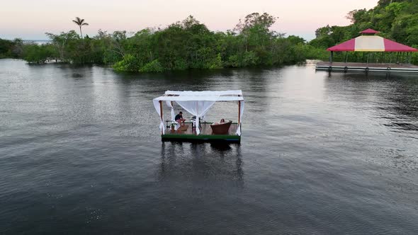 Couple of persons celebrating valentines day at Amazon River. alt
