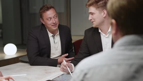 A company of office employees brainstorm together with the CEO of the company. creative process alt