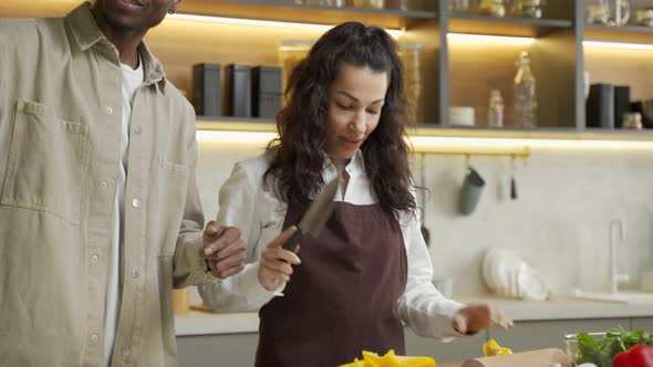 Man Records Video of Woman Partner Cooking in Kitchen alt