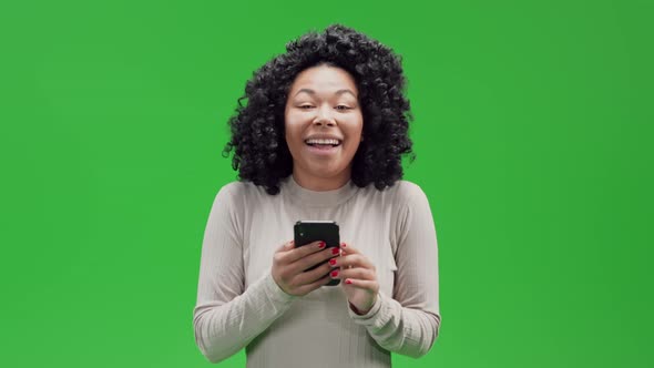 Green Screen Young African Female Holding Mobile