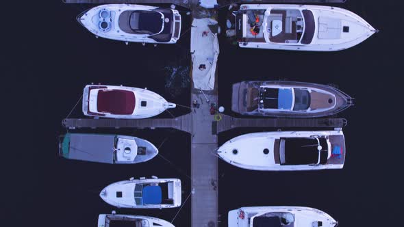 Flight of the Drone in the Summer Evening Over Yachts, Sailboats. Top View, Motion in the Frame