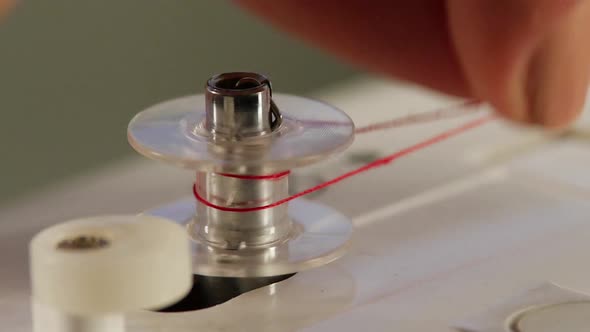 Reel Up the Thread. Slow Motion alt