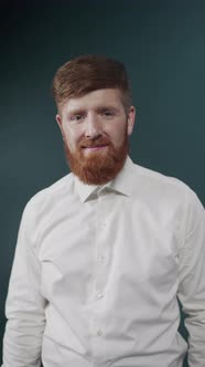 A Young Guy with Red Hair and Beard Posing in White Shirt with Cufflinks alt