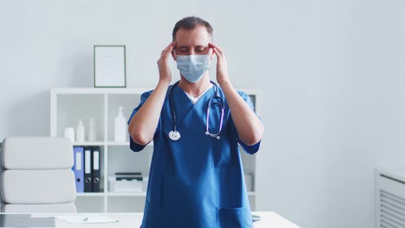Professional medical doctor working in hospital office using computer technology. alt