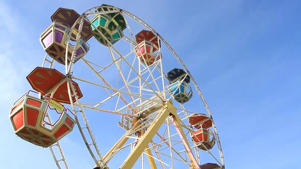 Ferris Wheel On The Blue Sky