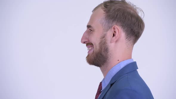 Profile View of Happy Bearded Businessman Smiling