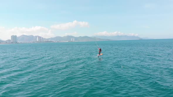 Aerial View of the City Beach and Active People Practicing Kite Surfing and Windsurfing. Kitesurfing alt