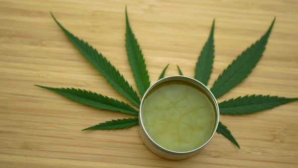 Lubricates Cream Cannabis Hemp Ointment on Hand Medicinal Cannabidiol CBD Leag Leaves, Body Massage